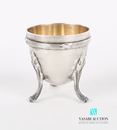 null Silver egg cup with a body hemmed with nets and crossed ribbons and resting...