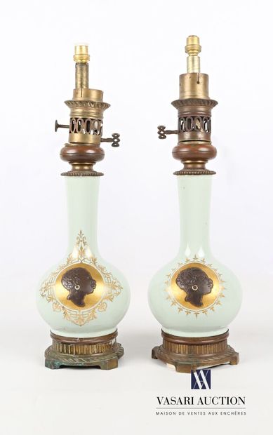 null Pair of celadon earthenware lamp bases, the spherical body decorated with medallions...