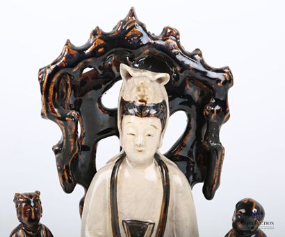 null CHINA

Statuette representing Kwan Yin seated in rajalilasana on a throne, holding...