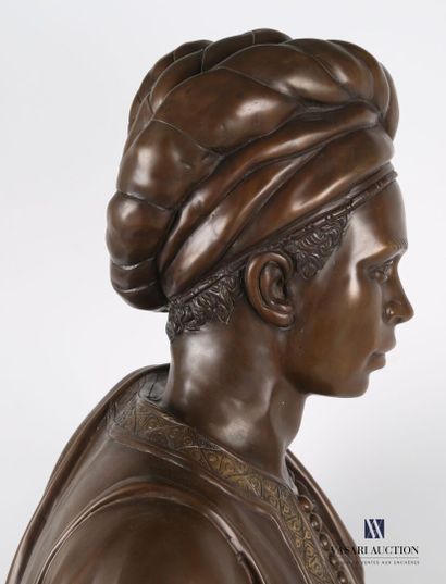 null Bust in bronze with brown patina representing a Moor in ribbons resting on a...
