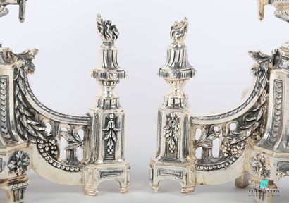 null Pair of silver-plated bronze andirons with a flaming baluster urn decorated...
