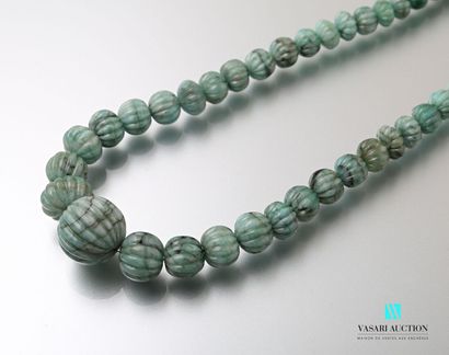 null Ethnic style necklace adorned with emerald root beads on a sliding cord.