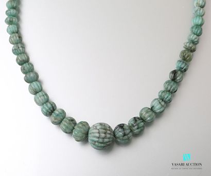 null Ethnic style necklace adorned with emerald root beads on a sliding cord.