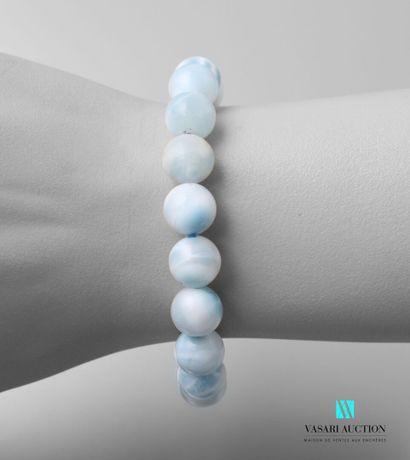 null Bracelet decorated with larimar beads on elastic cord.