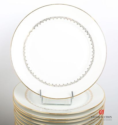 null White porcelain dinner service with gilded decoration of net and frieze of scrolls...