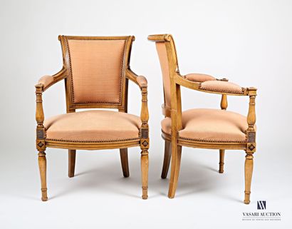 null Pair of armchairs in molded and carved natural wood, the slightly curved back...