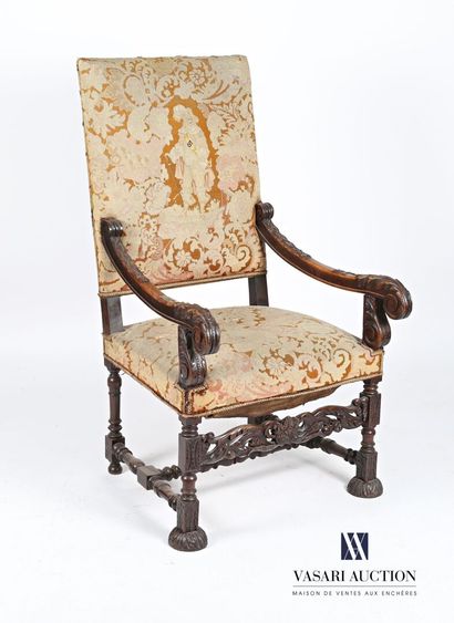 null Armchair in molded and carved natural wood, the rectangular back, the armrests...