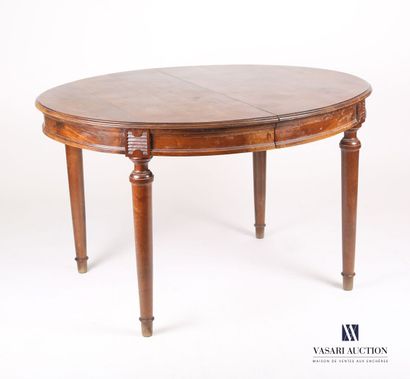 null Dining room table in mahogany, the tray of oval shape with band, it rests on...