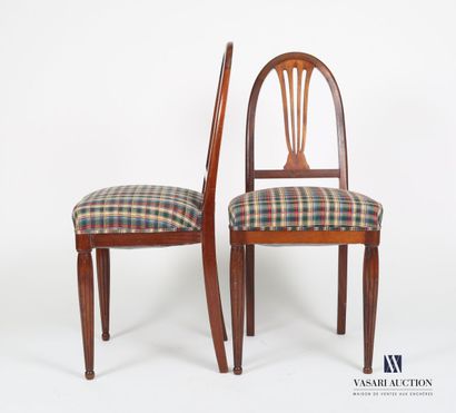 null Pair of chairs in molded mahogany, the curved back decorated with a stylized...