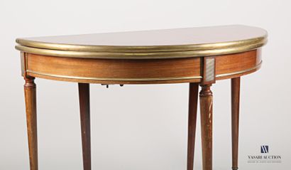 null Half moon table in mahogany and mahogany veneer inlaid with leaf in brass framing,...