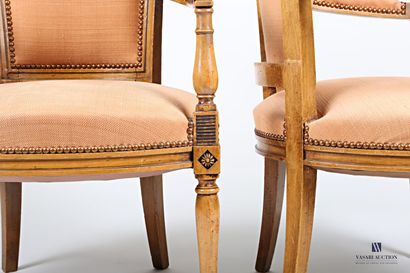null Pair of armchairs in molded and carved natural wood, the slightly curved back...