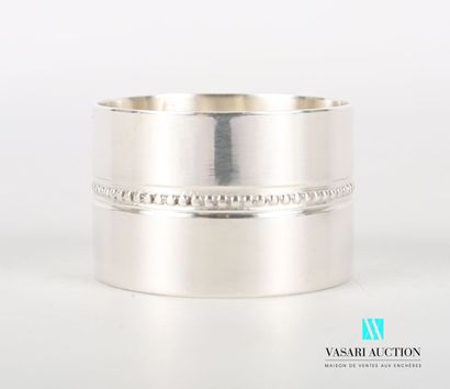 null Silver napkin ring of round shape, the body decorated with a frieze of pearls...