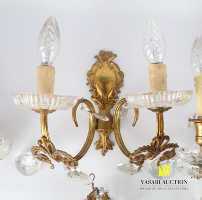 null Lot including a pair of gilded metal sconces with two arms of light, the shaft...