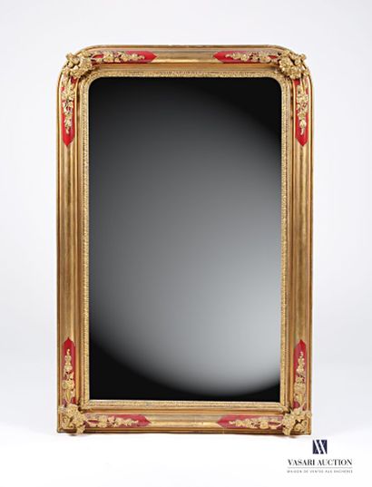 null Wooden mirror and stucco molded, carved, painted and gilded with decoration...