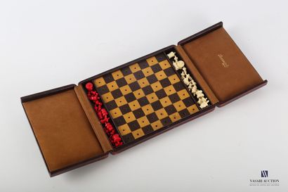 null Travel chessboard in a burgundy red morocco box, the checkerboard in leather....