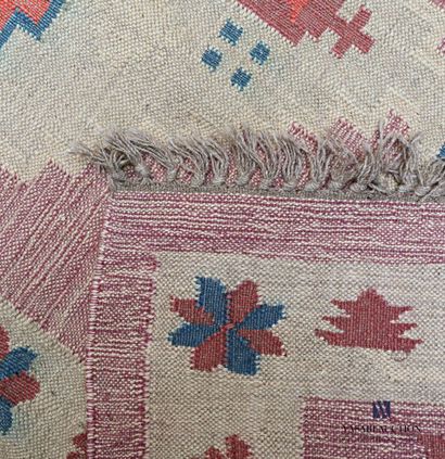 null Kilim carpet probably Indian with geometric patterns on an old pink background

181...