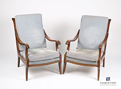 null Pair of armchairs in natural wood, the overturned back finished by scrolls is...