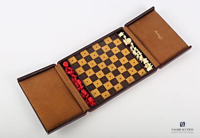 null Travel chessboard in a burgundy red morocco box, the checkerboard in leather....