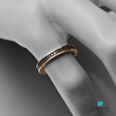 null Wedding ring in pink gold 750 thousandth set with small black diamonds of approximately...