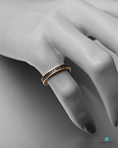 null Wedding ring in pink gold 750 thousandth set with small black diamonds of approximately...