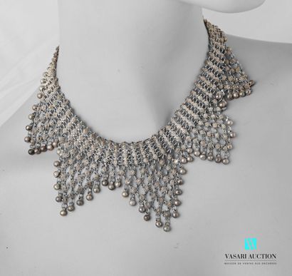 null Silver drapery necklace composed of small openwork cone elements connected by...