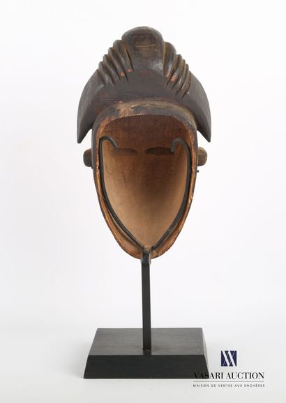 null PUNU - GABON

White female mask in carved wood with patina and pigment, the...