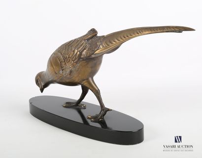null Subject in gilded patinated regula representing a pheasant hen, it rests on...