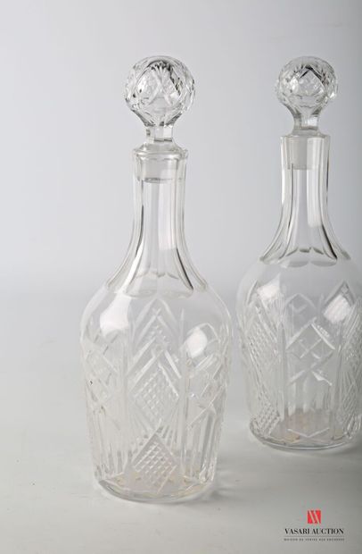 null BACCARAT 

Pair of crystal decanters cut with diamond points and flutes.

Two...