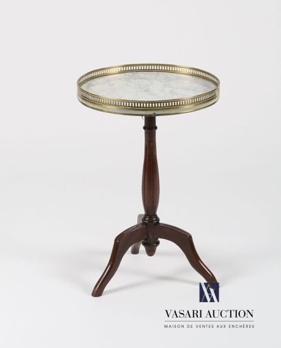 null Pedestal table in molded mahogany, the tray of round shape darkened by a white...