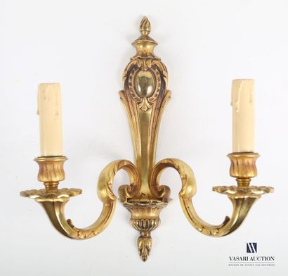 null Suite of three sconces in bronze, the tapered shaft has a blind cartouche supporting...