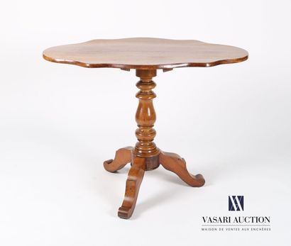 null Pedestal table in molded walnut, the tilting top of violin shape rests on a...