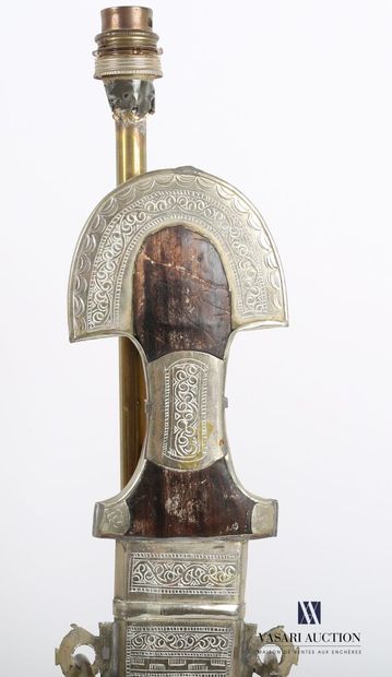null Two brass lamp stands on an oblong base, the shaft is decorated with a North...