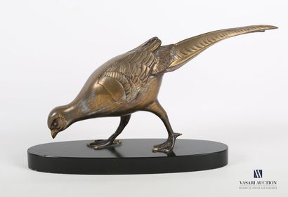 null Subject in gilded patinated regula representing a pheasant hen, it rests on...