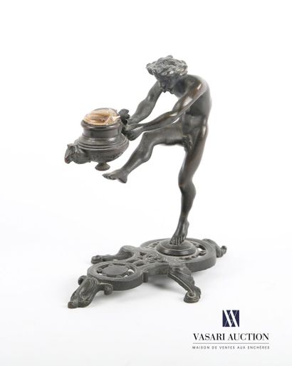 null Support in bronze with brown patina representing a man standing on one foot,...