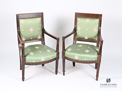 null Pair of armchairs in molded and stained natural wood. The straight backrest...