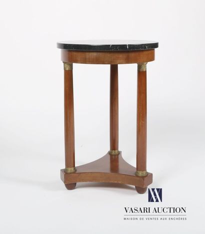 null Pedestal table in mahogany veneer, the round top in black marble rests on three...
