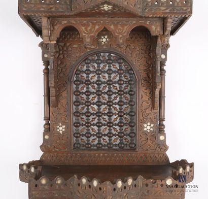 null Shelf of architectural form out of moulded and carved wood and inlays, it presents...