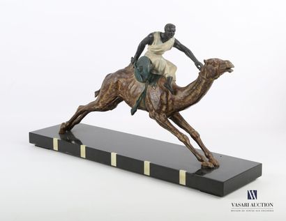 null Subject in patinated regula representing a rider on his galloping dromedary....