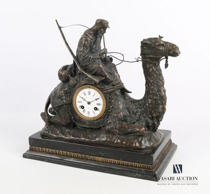 null Bronze clock featuring a rider smoking a pipe and wearing a moukalah riding...