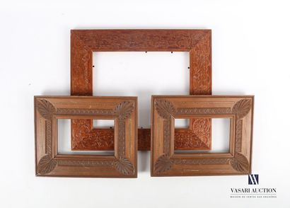 null Lot including three frames

- Two molded and carved wood frames decorated with...