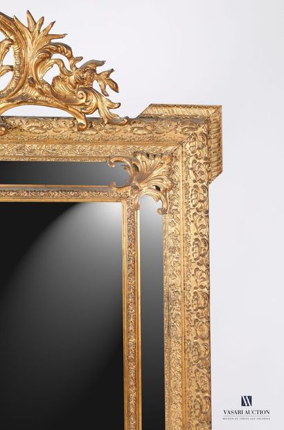 null Mirror with glazes in wood and stucco molded, carved and painted gilded, the...