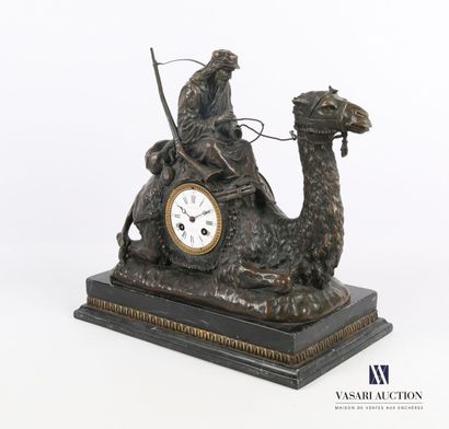 null Bronze clock featuring a rider smoking a pipe and wearing a moukalah riding...