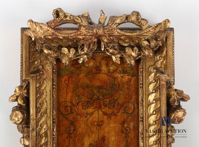 null Barometer in wood and gilded stucco decorated with a frieze of piastres, it...