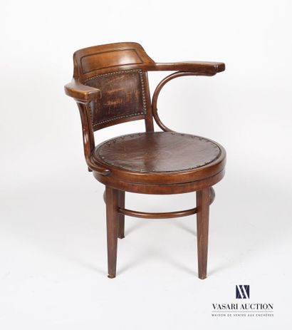 null Office armchair in natural wood molded and curved, the dark back of a cake is...