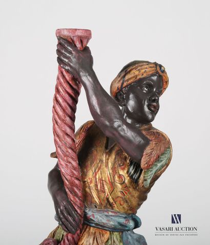 null Carved wood torch holder treated in polychromy representing a Nubian. It rests...