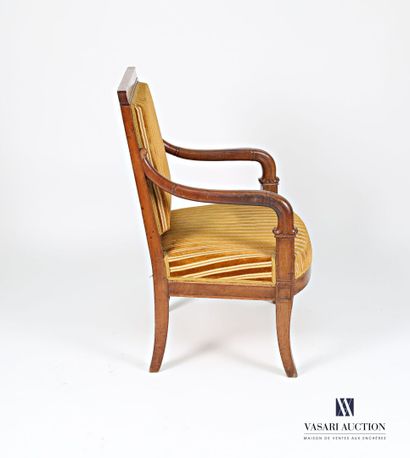 null Armchair in molded natural wood, the straight back with a galette, the scrolled...