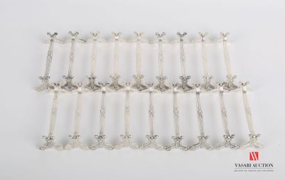 null Suite of twelve silver plated knife holders decorated with nets and crossed...