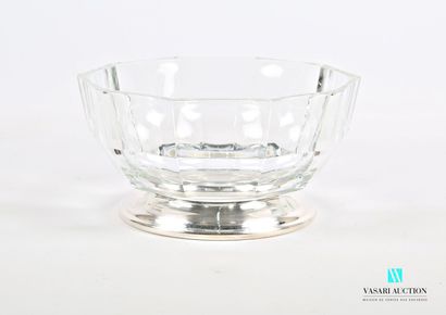 null Glass salad bowl of round form with cut sides, it rests on a round base out...