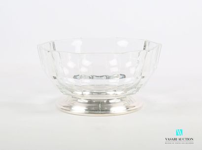 null Glass salad bowl of round form with cut sides, it rests on a round base out...