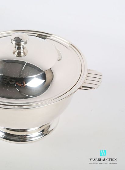 null Soup tureen covered in silver plated metal posing on a pedestal base, the plain...